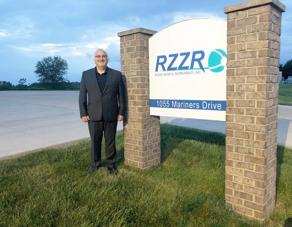 RAZOR Medical Instruments Inc., President, Bruce Khalili, stands in front of the company's new sign and entrance on Mariners Drive in Warsaw.